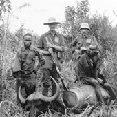 Photograph of Lallimullah, a Masai guide, Edward Douglas, 2nd Baron Loch, Henry Guest and another Masai, posing with a buffalo after hunting in the Soet Hills in British East Africa, now Kenya, 1910 (Crown Copyright, National Records of Scotland, GD268/1043 p.16v)