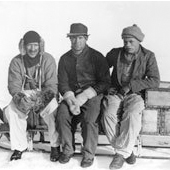 Photograph of Martin Lindsay, J M Scott and A Stephenson on a sledge during the British Arctic Air-Route Expedition of 1930-1931 (Crown Copyright, National Records of Scotland, GD254/1260/8)