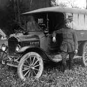 Photograph of a YMCA driver of the British 3rd Army, with his van in France, 1918 (Crown Copyright, National Records of Scotland, GD476/6/1/73)