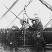 Photograph of a group of four riveters at work with a pneumatic riveting machine on the Forth Railway Bridge, 1887 (Crown Copyright, National Records of Scotland, BR/FOR/4/34/2)