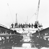 Photograph of workmen rivetting the top member of the Queensferry cantilever, 5 June 1888 (Crown Copyright, National Records of Scotland, BR/FOR/4/34/183)