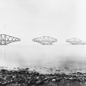 Photograph of the view from the east of the three piers of the Forth Railway Bridge, cantilevers completed but central connecting girders not yet commenced, 15 April 1889 (Crown Copyright, National Records of Scotland, BR/FOR/4/34/189)