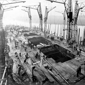 Photograph of the View looking down towards the bow of the deck showing guide rails for the turrets being fitted on the Royal Navy battlecruiser HMS Tiger under construction at John Brown & Co. shipyard, Clydebank, 5 December 1913 (Crown Copyright, National Records of Scotland,UCS1/116/10/49)