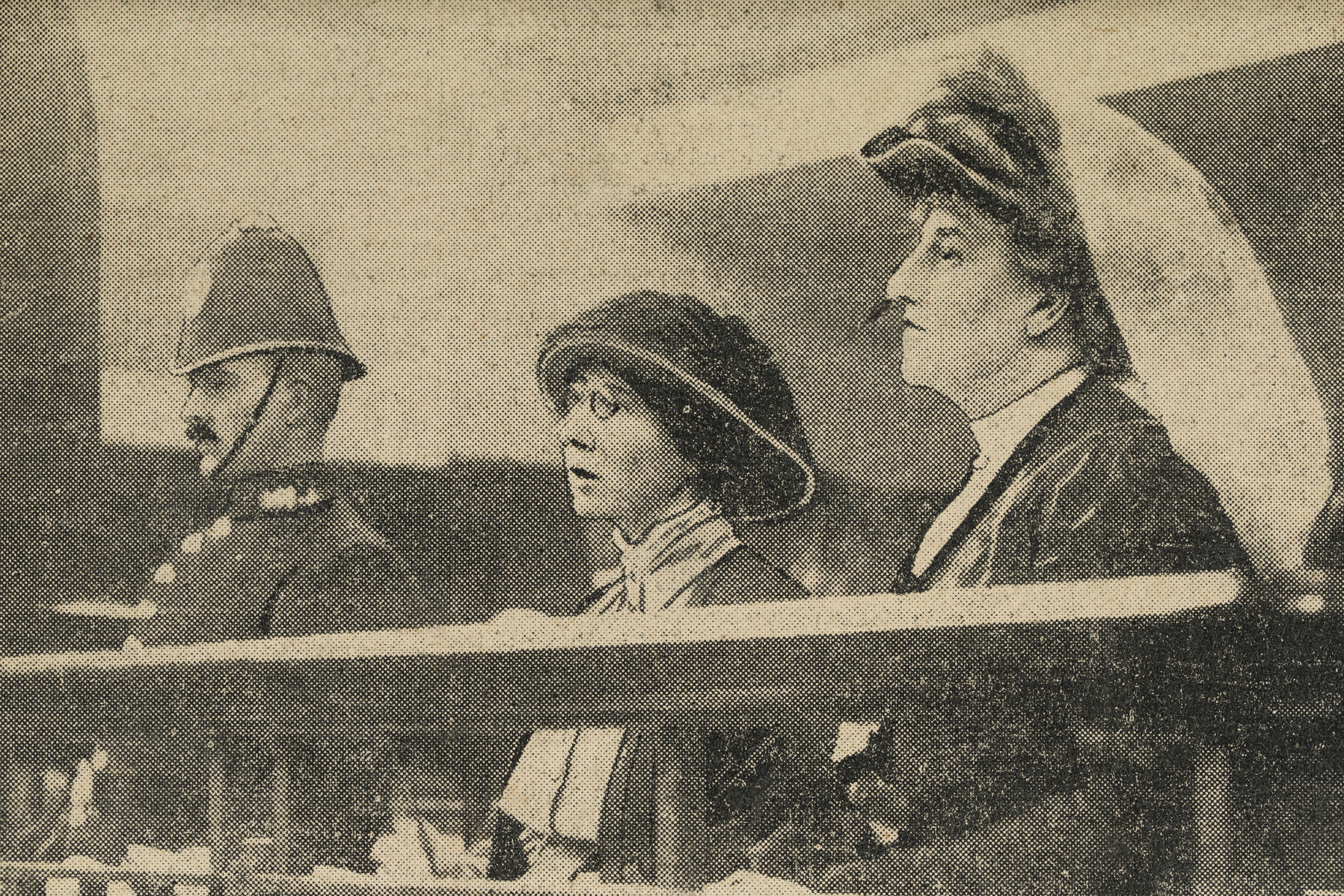 Image from a newspaper of a policeman, Ethel Moorhead and Dorothea Chalmers Smith (from right to left)